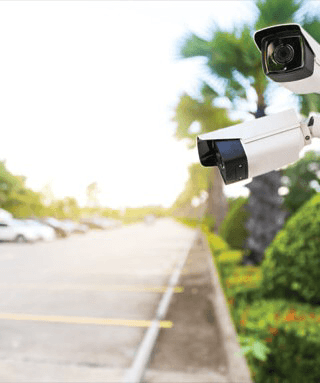 Security cameras overlooking a property driveway
